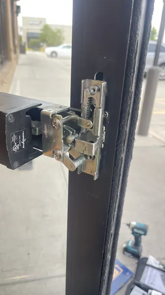 First Choice exit device (push bar) opened up on a storefront door during repair