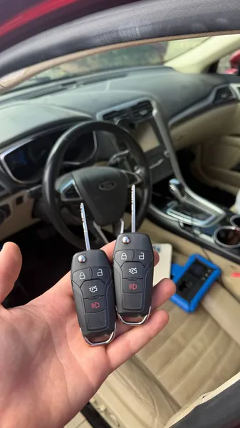 Two Ford flip keys held inside a Ford