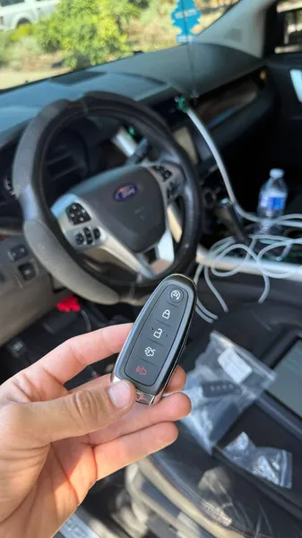 Ford smart key with programming cables in the cabin