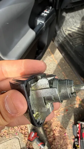 Ignition lock cylinder in its housing, taken out of a car