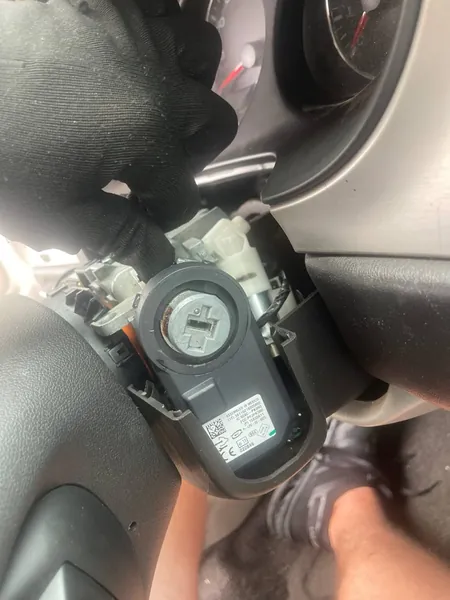 Ignition switch exposed under the steering column trim