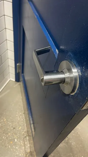 Lever handle on a blue steel door