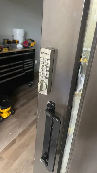 Mechanical push-button lock on a metal door