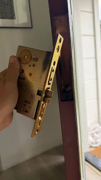 Mortise lock body pulled out of the door edge