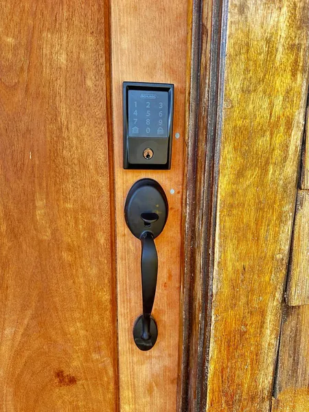 Touchscreen deadbolt and handleset on a wood door